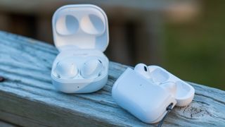 Samsung Galaxy Buds 2 Pro and AirPods Pro 2 case open on porch ledge alt