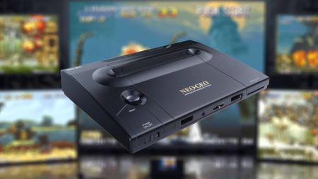 Neo Geo AES+ with gameplay footage from trailer blurred in backdrop.