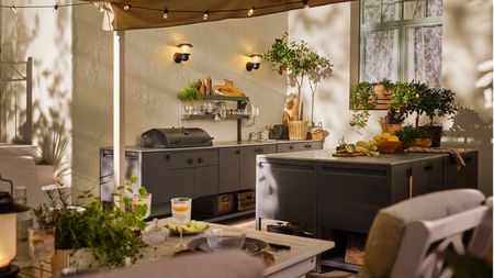 A backyard featuring IKEA's Batskar collection outdoor kitchen