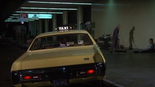 taxi sitting on a curb in Airplane!