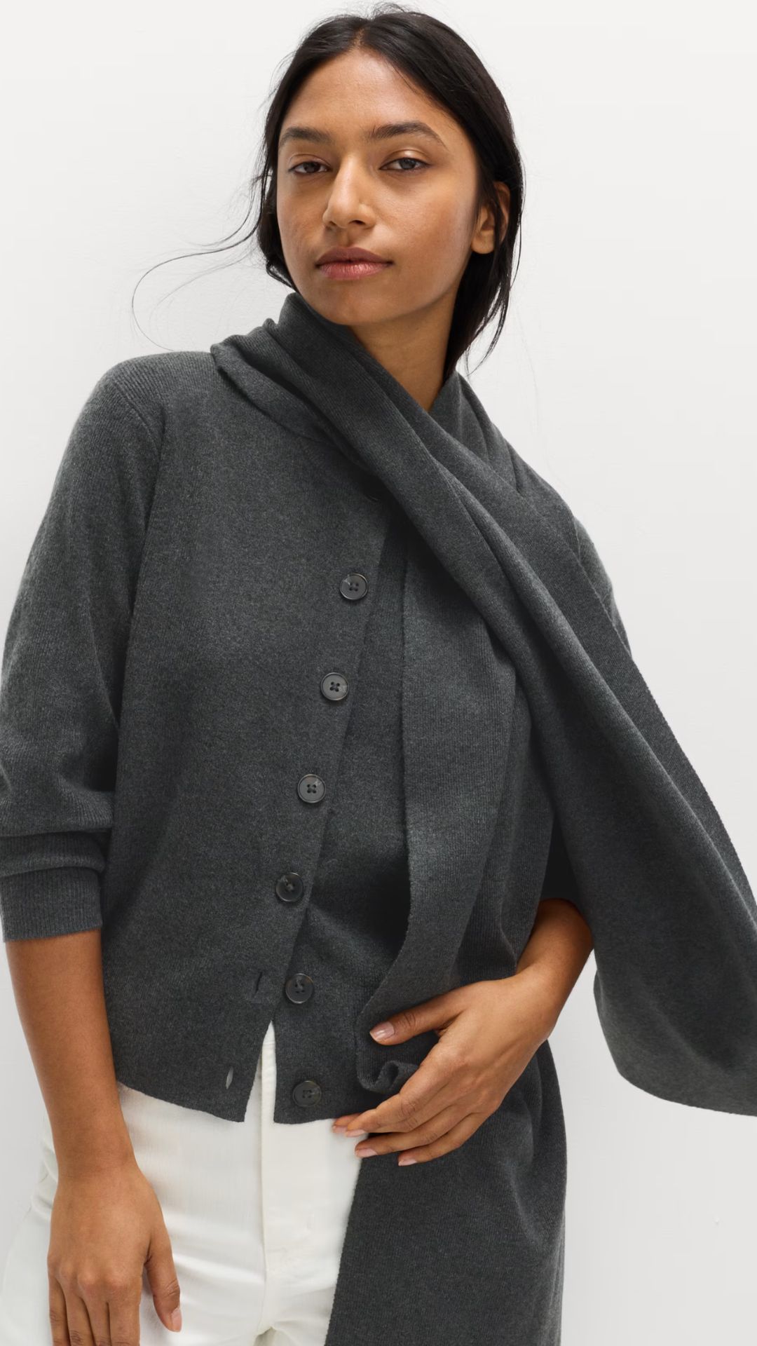 a model wearing a grey scarfigan