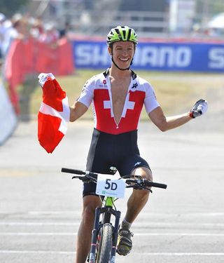 Ralph Naef crosses the finish and takes the win for Switzerland