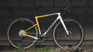 A side-on view of the Ridley Kanzo Adventure in silver and yellow, with a SRAM Rival groupset