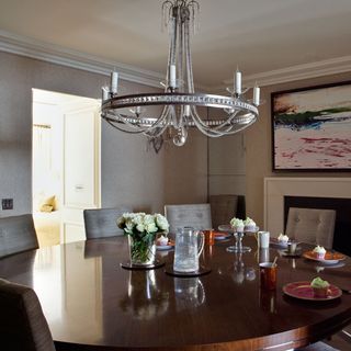 dining area with dining table and bespoke chandelier