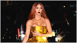 Megan Fox with copper hair and wearing a gold dress in New York City 2022
