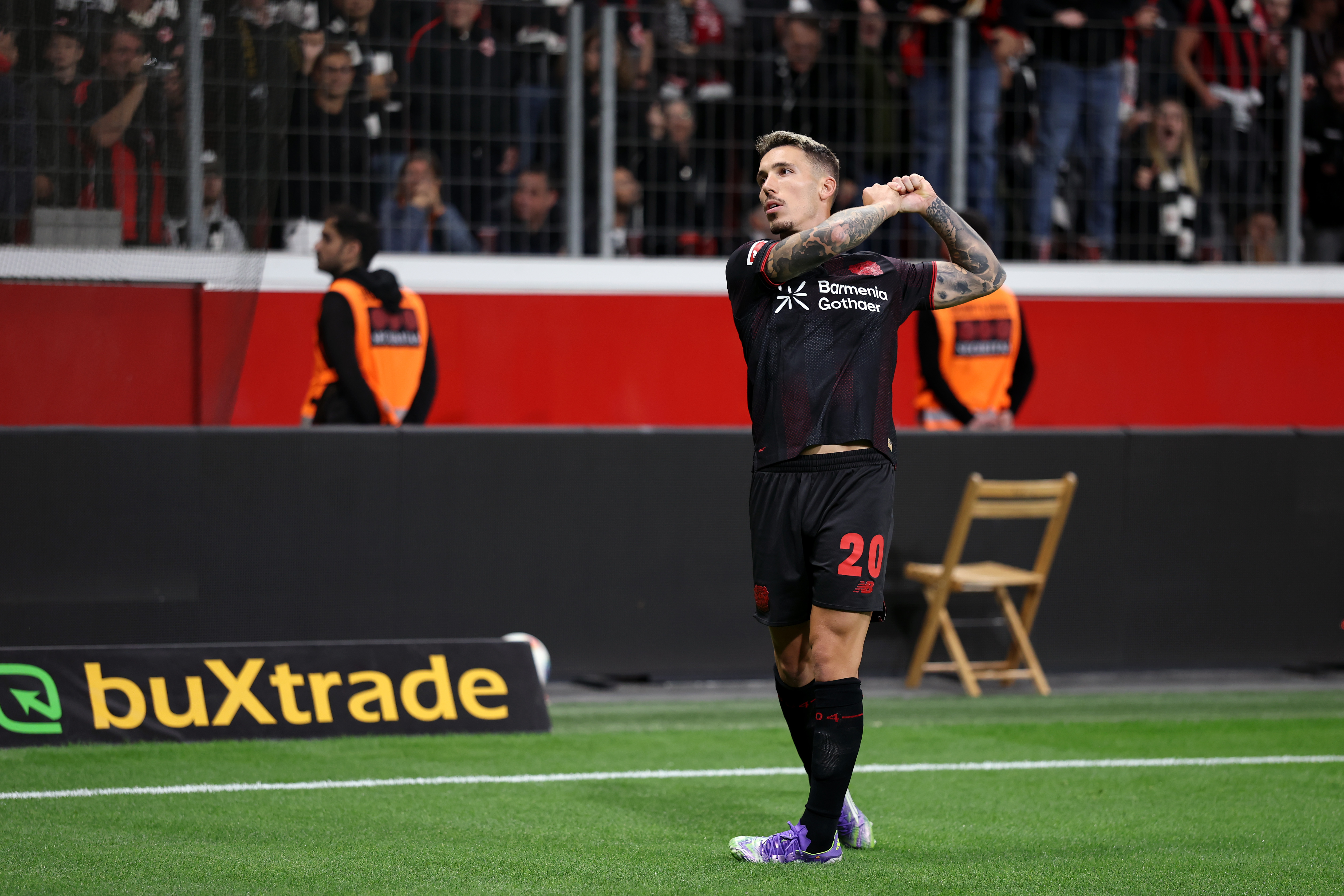 Alex Grimaldo of Bayer Leverkusen celebrates his team's first goal, an own goal scored by Michael Zetterer of Eintracht Frankfurt (not pictured) during the Bundesliga match between Bayer 04 Leverkusen and Eintracht Frankfurt at BayArena on September 12, 2025 in Leverkusen, Germany.