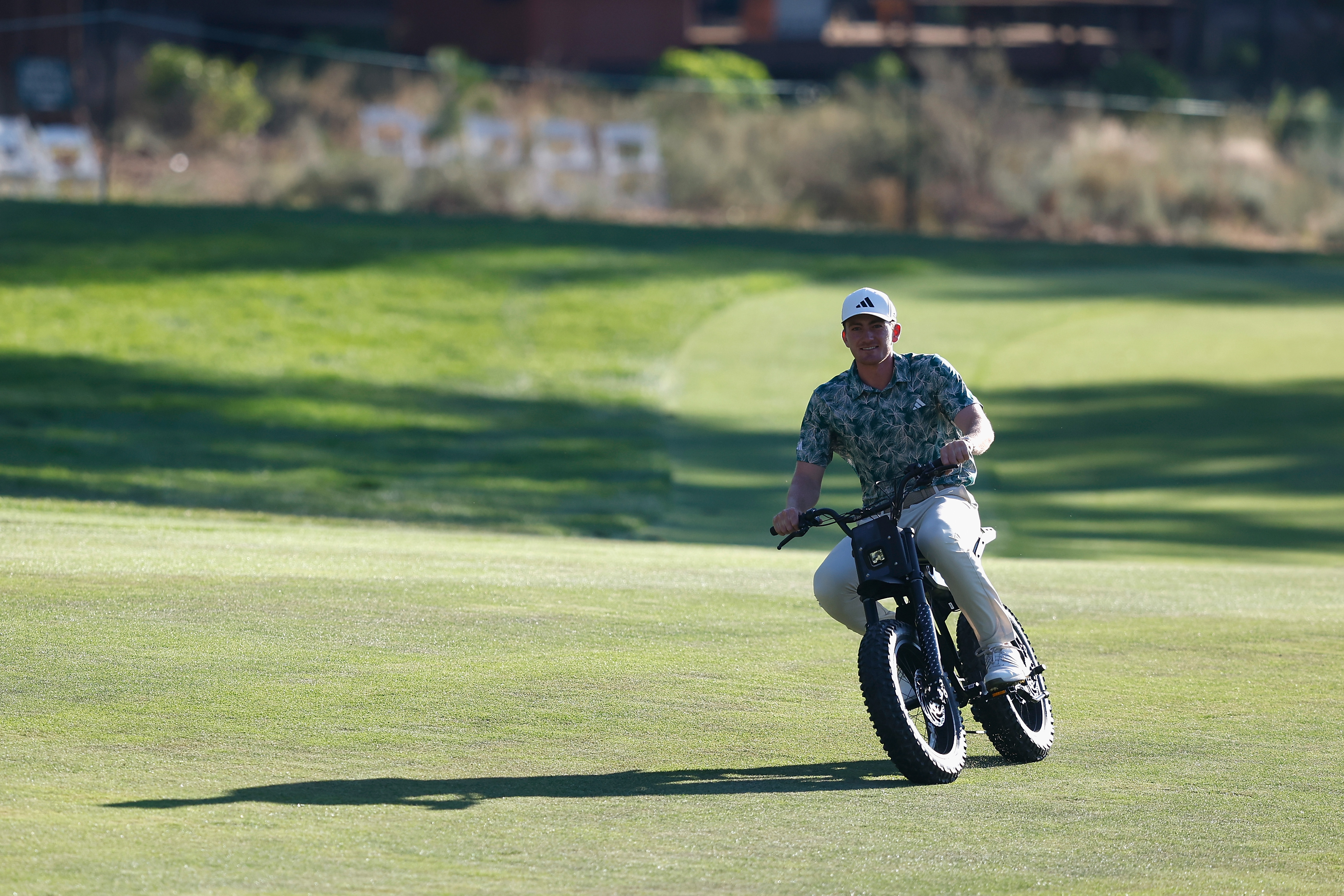 Nick Dunlap rides around on a motorbike after winning the Barracuda Championship in 2024