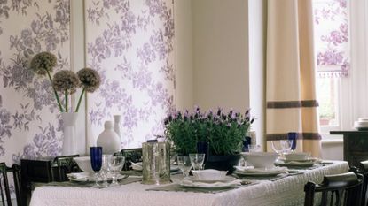 dining room with table and floral wallpapers