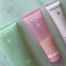 Caudalie products on a marble table
