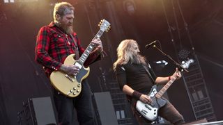 Guitarist Brent Hinds (left) and bassist Troy Sanders of Mastodon perform during Carolina Rebellion at Charlotte Motor Speedway on May 5, 2017 in Charlotte, North Carolina