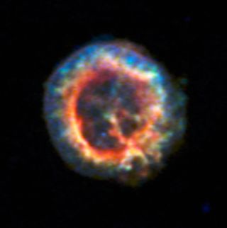 The supernova remnant 1E 0102.2-7219 shows up dramatically in this image, created by combining data from the Chandra X-ray Observatory and the MUSE instrument on the Very Large Telescope. The blue dot just below center was discovered to be an isolated neutron star with a weak magnetic field, the first such neutron star identified outside the Milky Way.