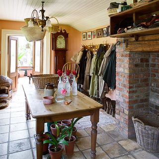 boot room with flagstone flooring and plant in pots