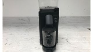 Moccamaster grinder on its own on a marble countertop