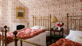 A room dressed in Chintz fabrics and wallpaper