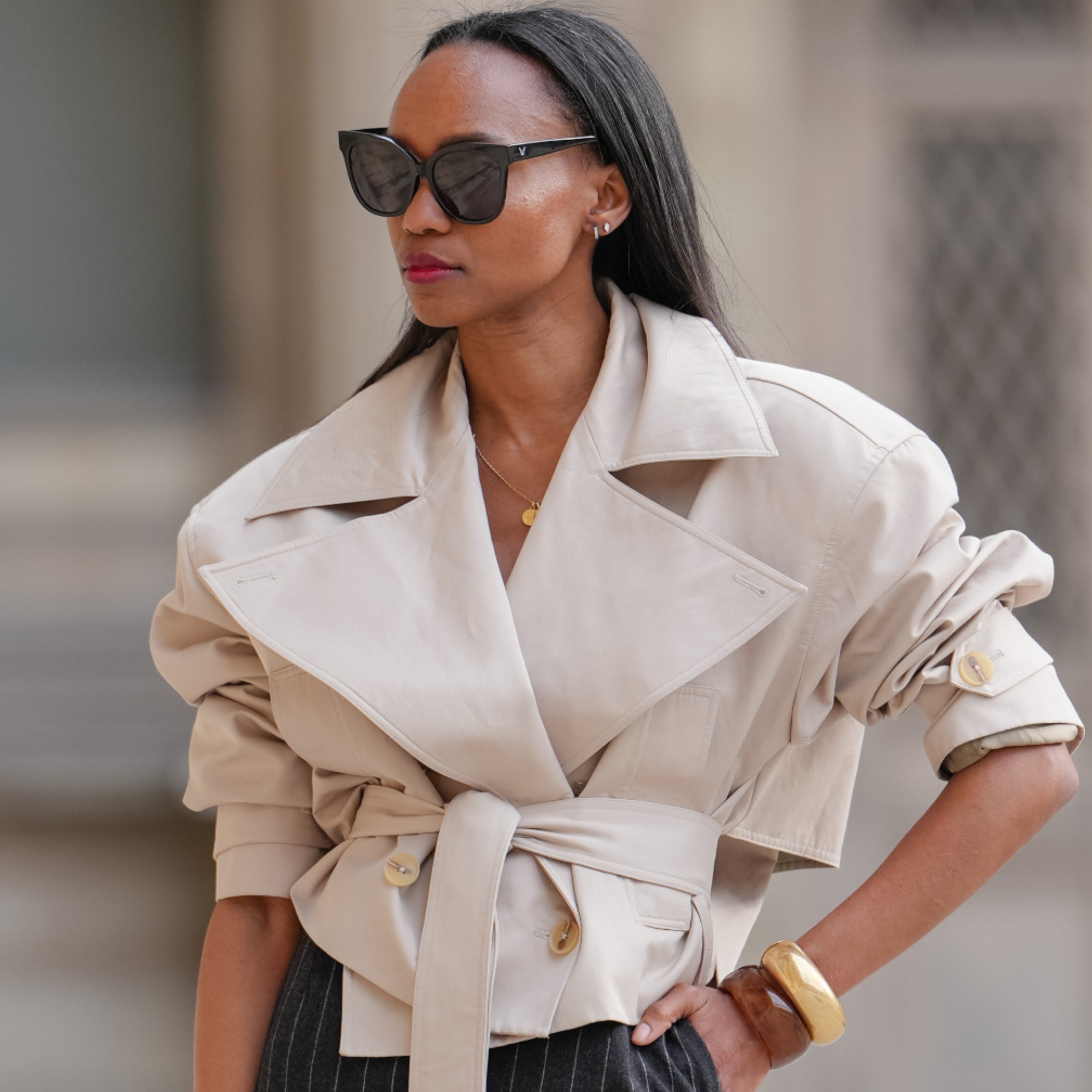 woman wearing a cropped trench coat