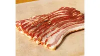 Uncooked rashers of bacon, one of w&h's best Christmas food gifts