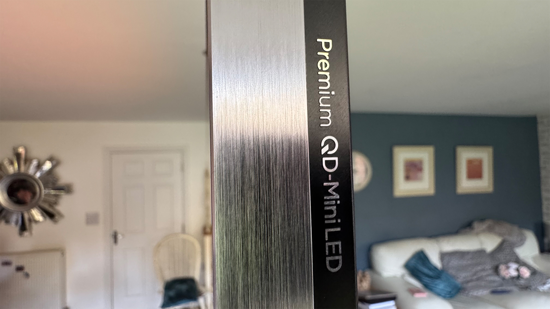 TCL C8K 85-inch TV shot from side in living room