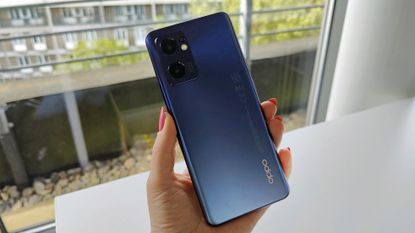 Oppo Find X5 Lite review: woman taking a selfie on a phone