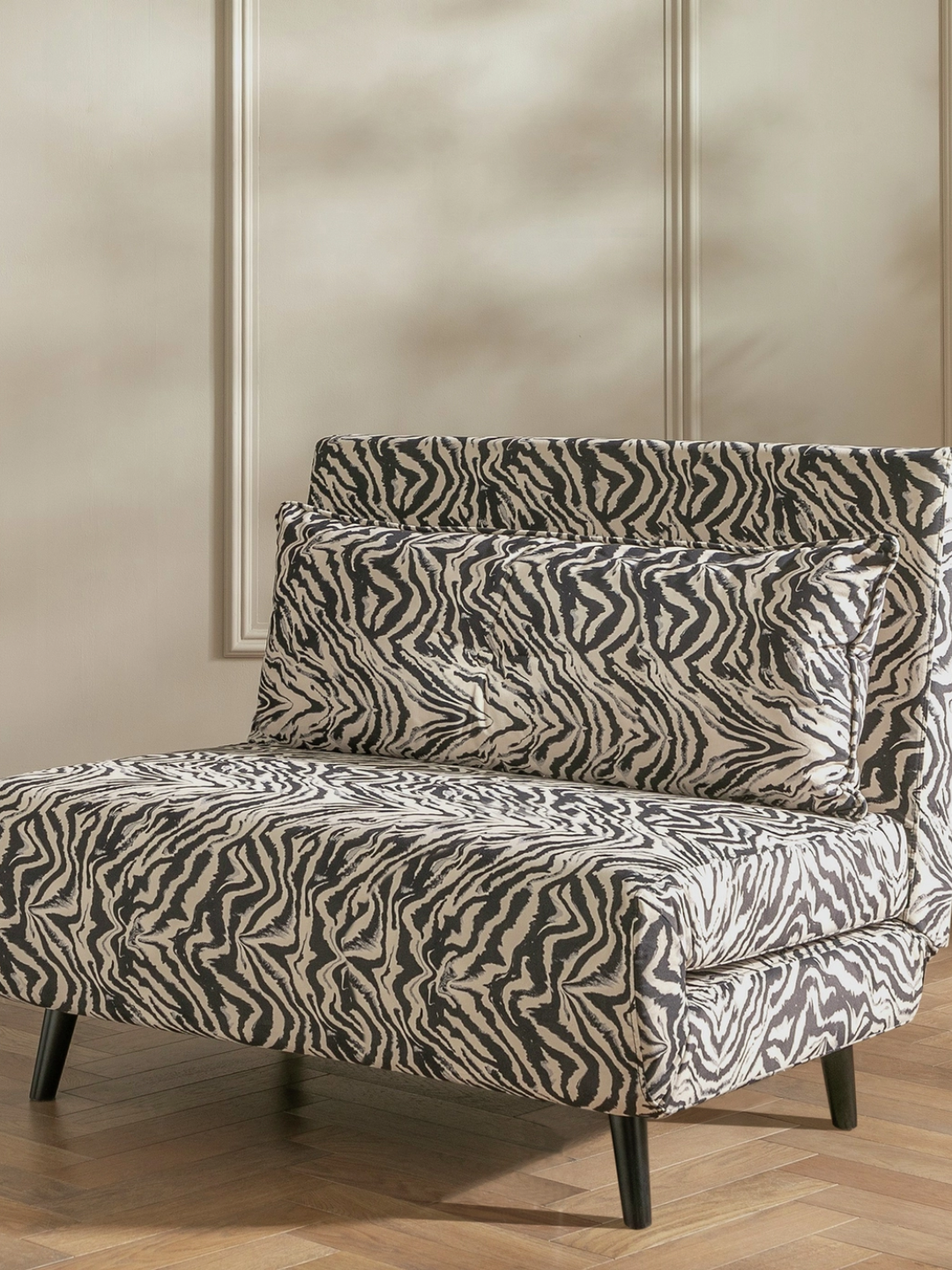 A zebra print chair bed
