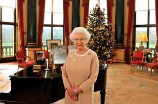 Queen Elizabeth II stands in the music room of Buckingham Palace after recording her Christmas day message to the Commonwealth on December 22, 2008
