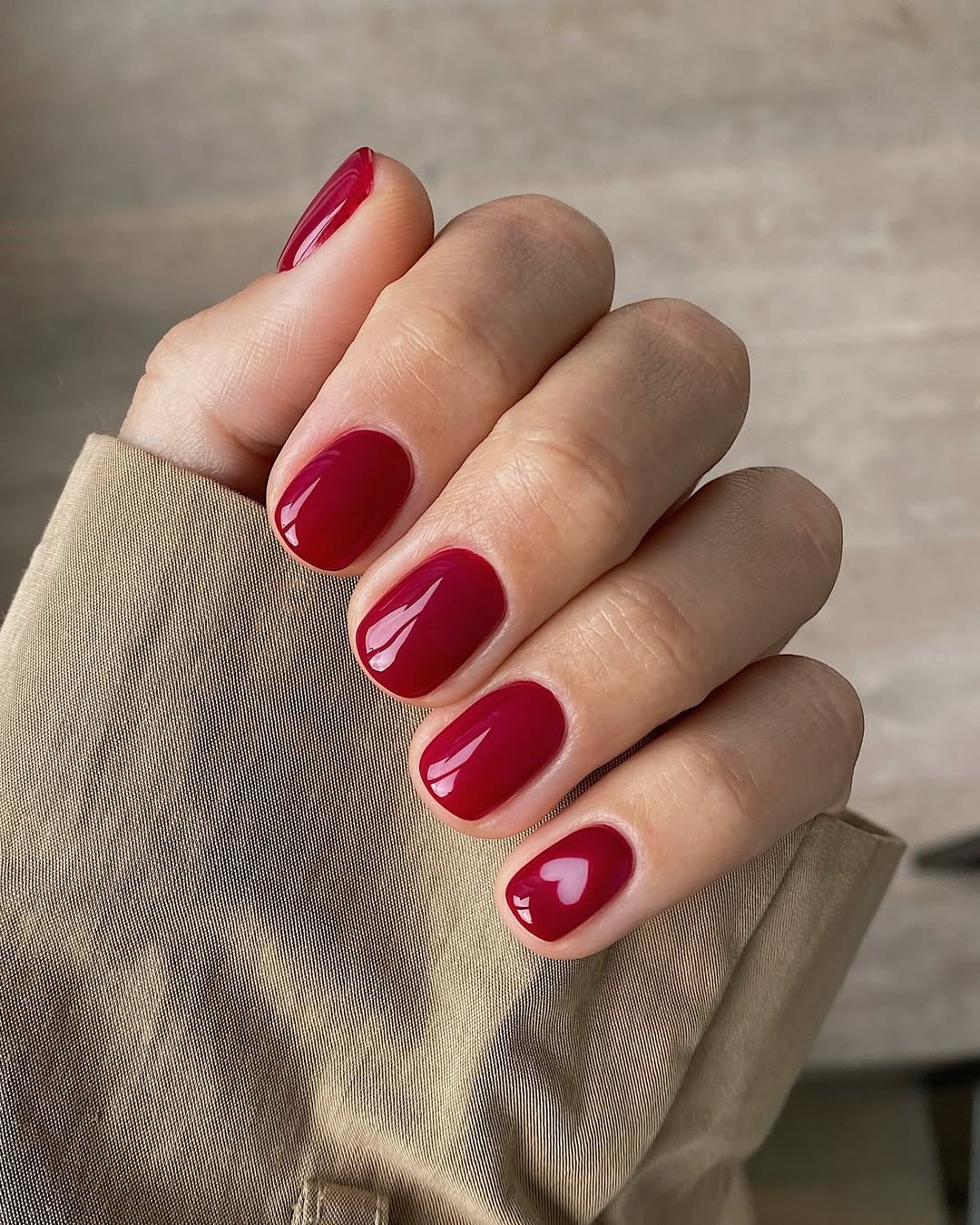 A cherry red manicure on Mate Janova