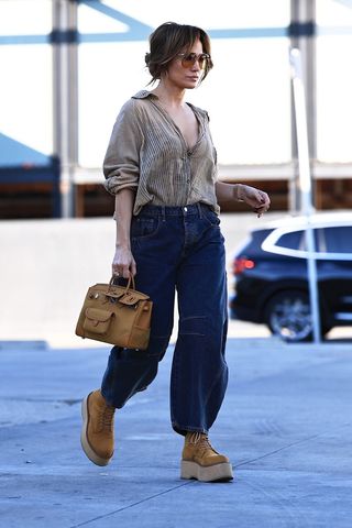 Jennifer Lopez wearing Free People barrel jeans.