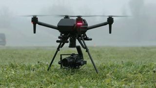 Sony Airpeak drone landed on the grass in misty conditions with gimbal and Sony camera