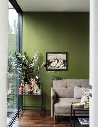 Green living room painted in Farrow & Ball Bancha