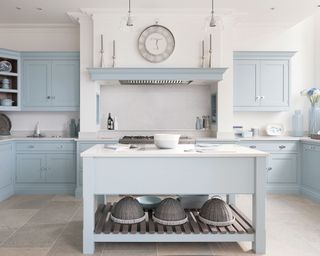 Light blue u-shaped kitchen with central island