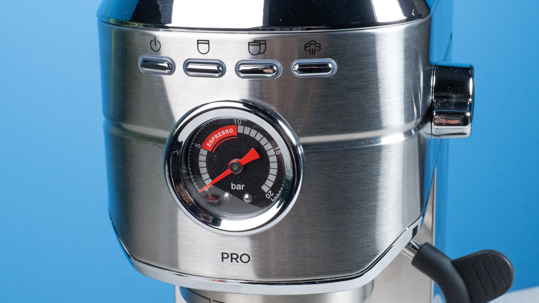 The Casabrews 5418 Pro espresso machine in stainless steel with a steam wand on the right side and three buttons on the front of the machine and a pressure gauge underneath