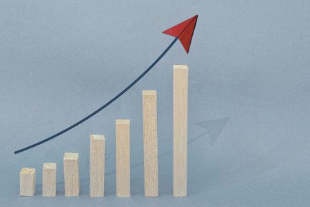 rendering of thin blocks of increasing height with an upward arrow above indicating growth