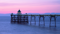 Clevedon pier under a pink dusky sky