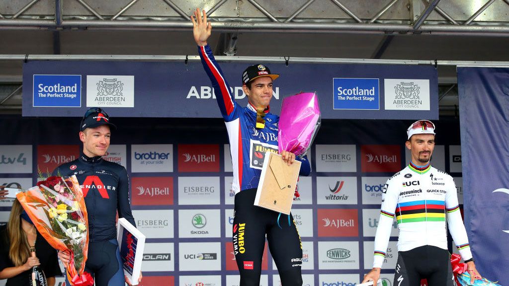 ABERDEEN SCOTLAND SEPTEMBER 12 LR Ethan Hayter of United Kingdom and Team INEOS Grenadiers in second place Wout Van Aert of Belgium and Team Jumbo Visma blue leader jersey and Julian Alaphilippe of France and Team Deceuninck QuickStep in third place celebrate winning on the podium ceremony after the 17th Tour of Britain 2021 Stage 8 a 173km stage from Stonehaven to Aberdeen TourofBritain TourofBritain on September 12 2021 in Aberdeen Scotland Photo by Alex LiveseyGetty Images