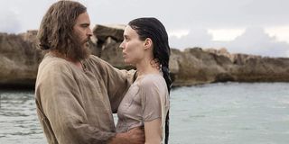 Mary Magdalene Joaquin Phoenix and Rooney Mara embracing in the water
