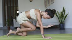 Woman doing core Pilates workout at home