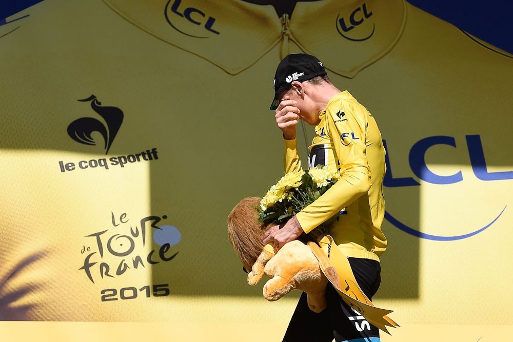 Chris Froome collects another lion on the stage 20 podium.
