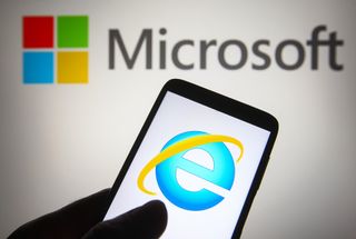 Internet Explorer logo on a smartphone with a Microsoft logo in the background