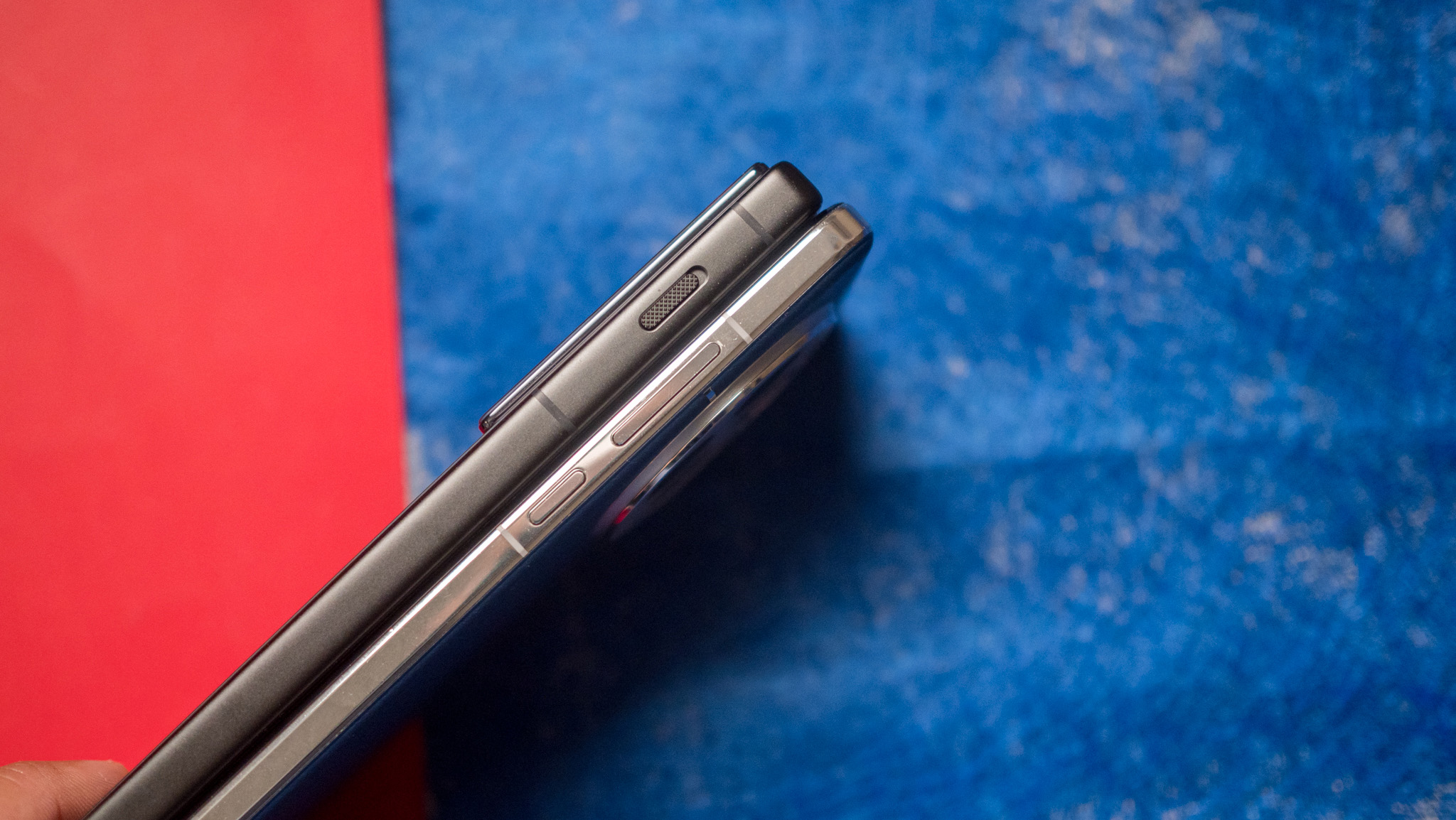 Nubia Z70 Ultra next to OnePlus 13 against a colorful background