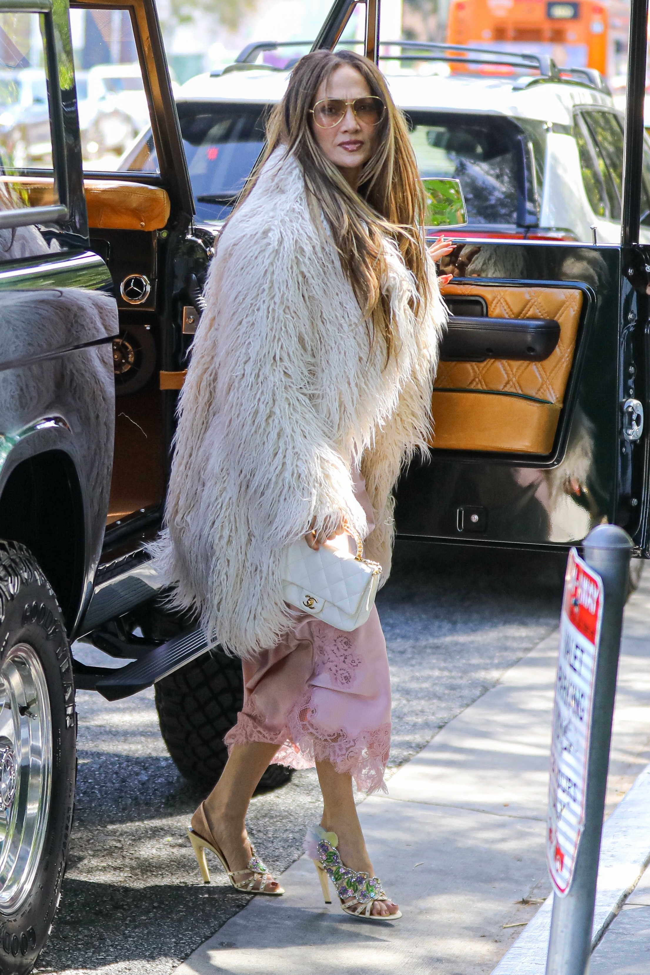 Jennifer Lopez was spotted in L.A. wearing the lace-trimmed satin slip dress trend for Spring 2026