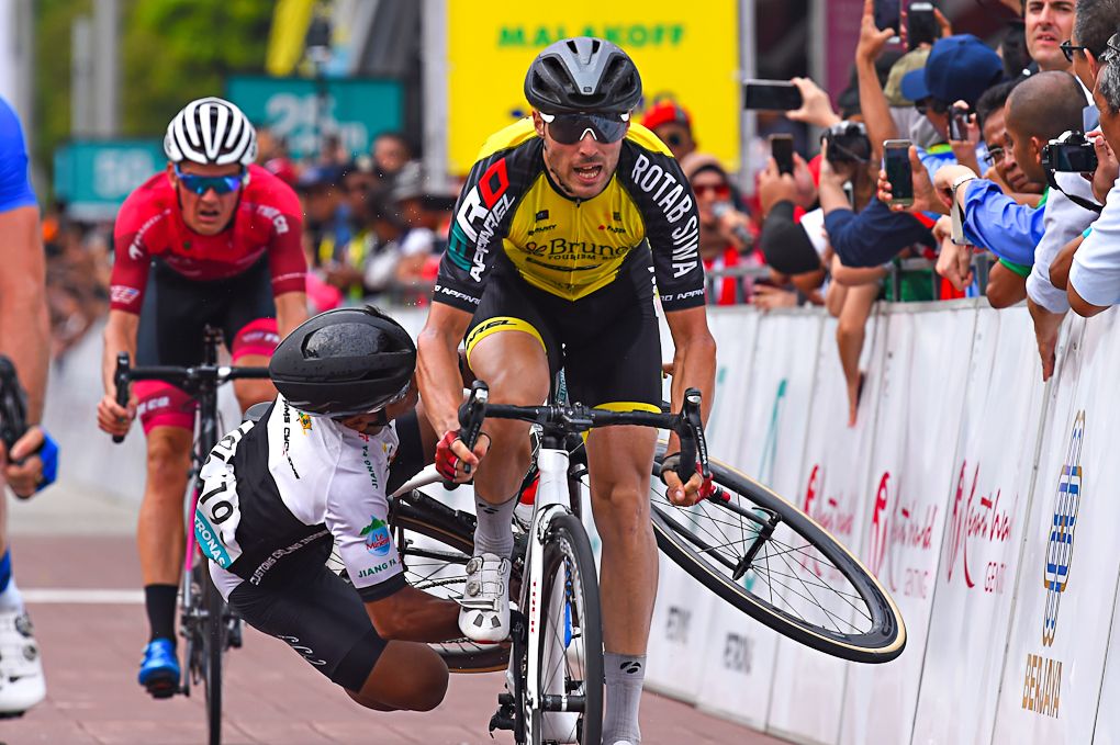 A rider goes down in the finishing straight of stage 3 at the Tour de Langkawi