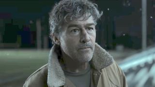 Hal Jordan in his jacket on the bleachers in Lanterns' finale.