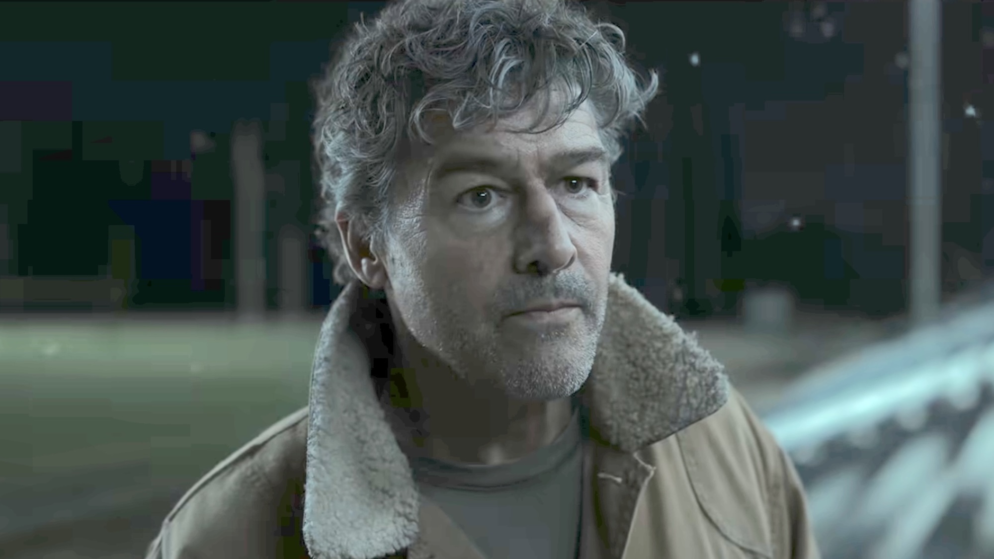Hal Jordan in his jacket on the bleachers in Lanterns' finale.