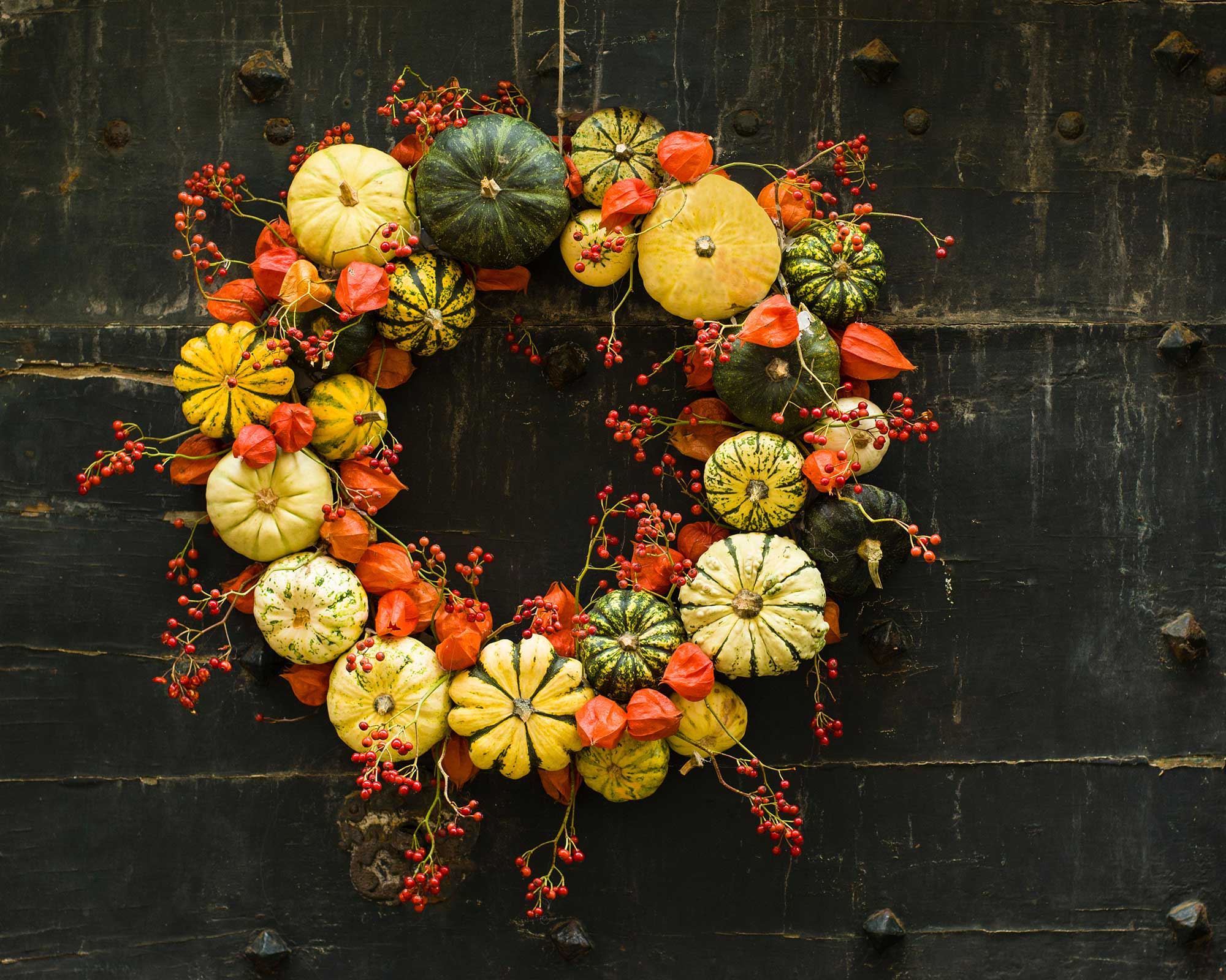 pumpkin wreath on vintage door