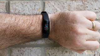 Fitbit Luxe worn on a hand