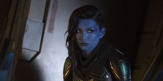 Minn-Erva (Gemma Chan) sits in the shadows in a scene from 'Captain Marvel'