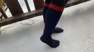 Skier's lower legs wearing the Helly Hansen Alpine Technical socks