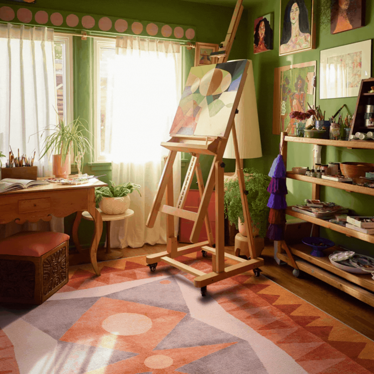 Justina Blakeney x Ruggable Hilma Sunset Flatwoven Rug in a rotating gif showcasing it inside a colorful artist studio and as a product against pale brown background.