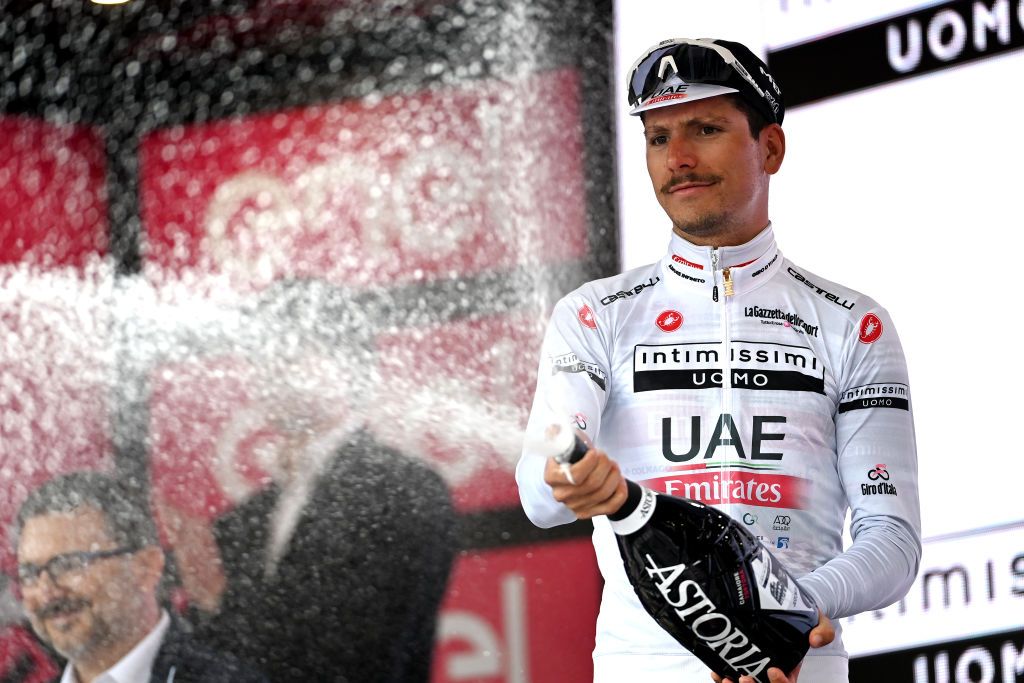 TORTONA ITALY MAY 17 Joo Almeida of Portugal and UAE Team Emirates celebrates at podium as White best young jersey winner during the 106th Giro dItalia 2023 Stage 11 a 219km stage from Camaiore to Tortona UCIWT on May 17 2023 in Tortona Italy Photo by Tim de WaeleGetty Images