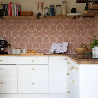 kitchen room with white wall with tiles and wooden counter
