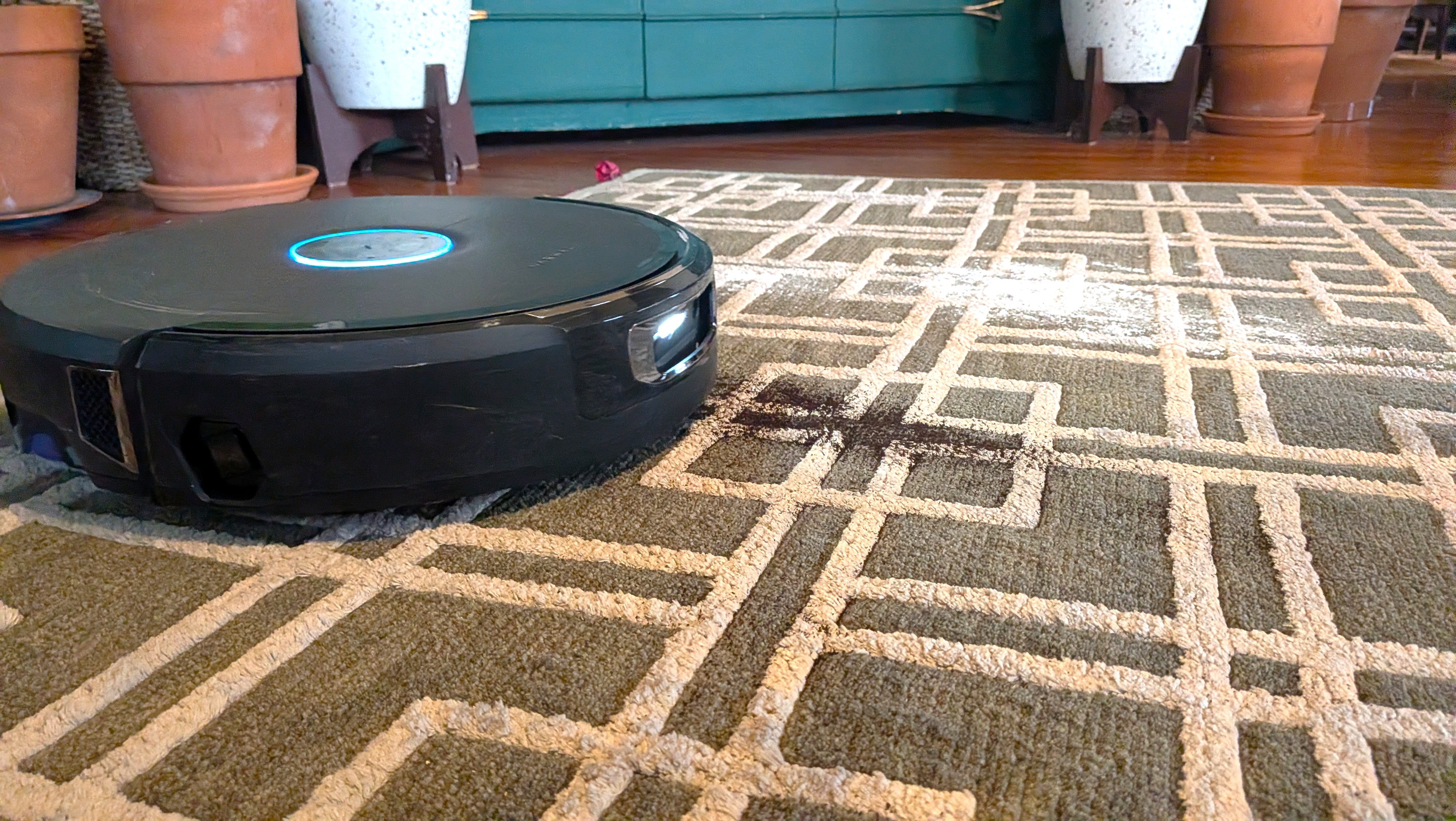 Narwal Flow 2 robot vacuum cleaning flour and soil from carpet